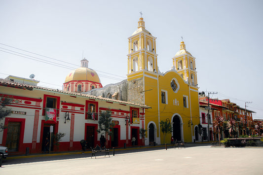 Small village street in Mexico with pedestrians